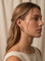 Iselin Oorbellen Stainless Steel Chunky Golvende Oorringen 2,5 cm Goudkleurig foto 2