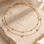 Lundholm Alessandra – Dubbellaagse Ketting met Bloemetjes – Goud