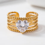 Lundholm Madelyn ring dames goudkleurig met sprankelende zirkonia hart steen, verstelbaar one size, premium stainless steel met 2.5 micron PVD gold plated coating, waterproof en hypoallergeen, Scandinavisch design