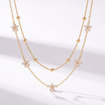 Lundholm Alessandra – Dubbellaagse Ketting met Bloemetjes – Goud