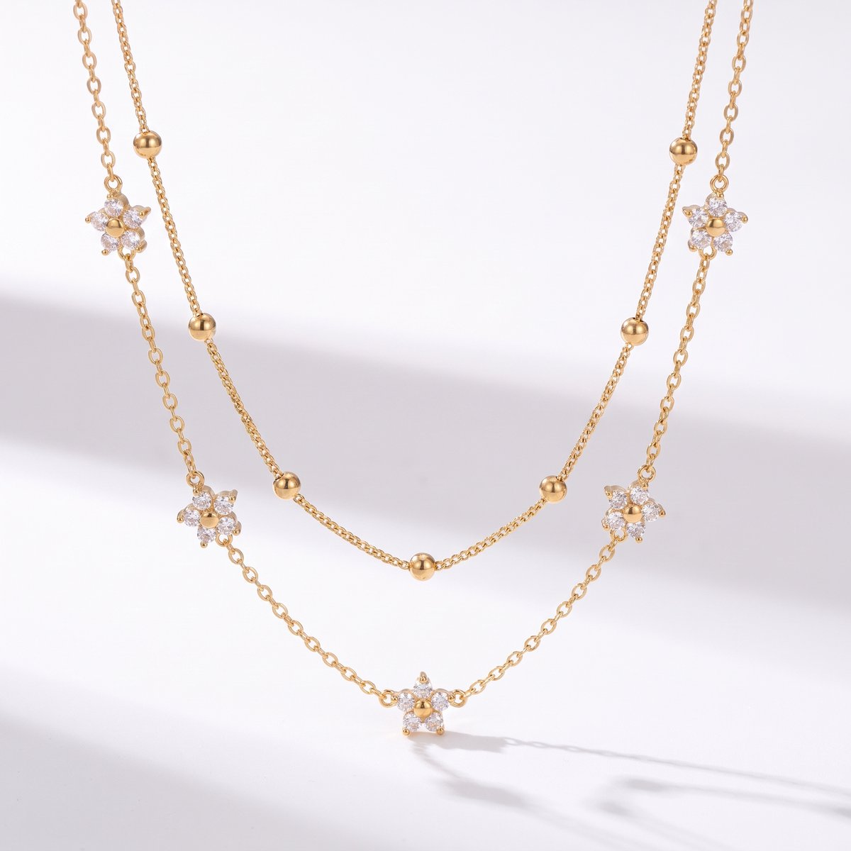 Lundholm Alessandra – Dubbellaagse Ketting met Bloemetjes – Goud