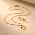 Lundholm Edda vlinder ketting en oorknopjes goud detail