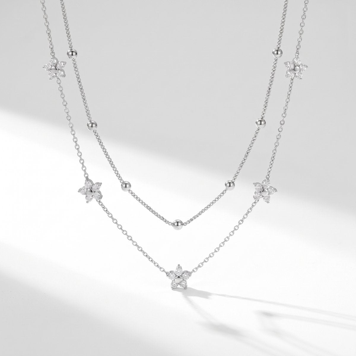 Lundholm Alessandra ketting dames zilverkleurig – dubbellaagse ketting met bloemetjes en zirkonia, stainless steel