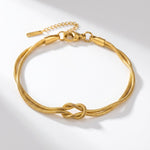 Lundholm Brianna armband dames goudkleurig – dubbele armband met knoop, gold PVD stainless steel