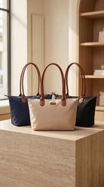 Lundholm Danviken shoppers in donkerblauw beige en zwart naast elkaar, drie kleuren tote bag schoudertas Scandinavisch design
