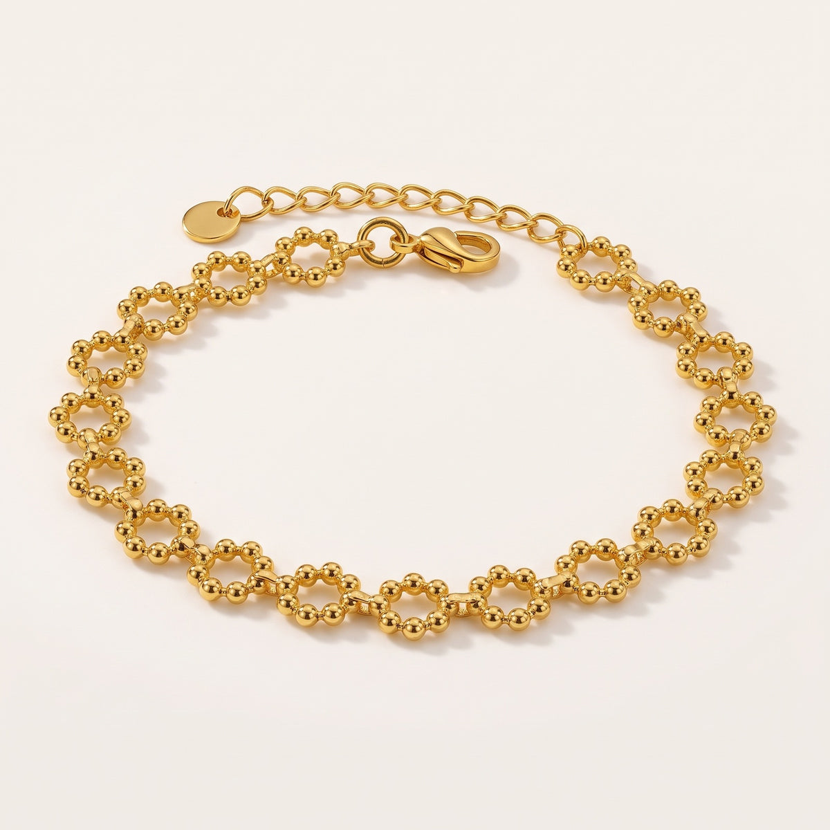 Fia – Schakelarmband met Bolletjes – Goudkleurig