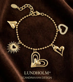Lundholm luxe schakelarmband My Love met hartjes bedels in goudkleurig, Scandinavian Design productfoto